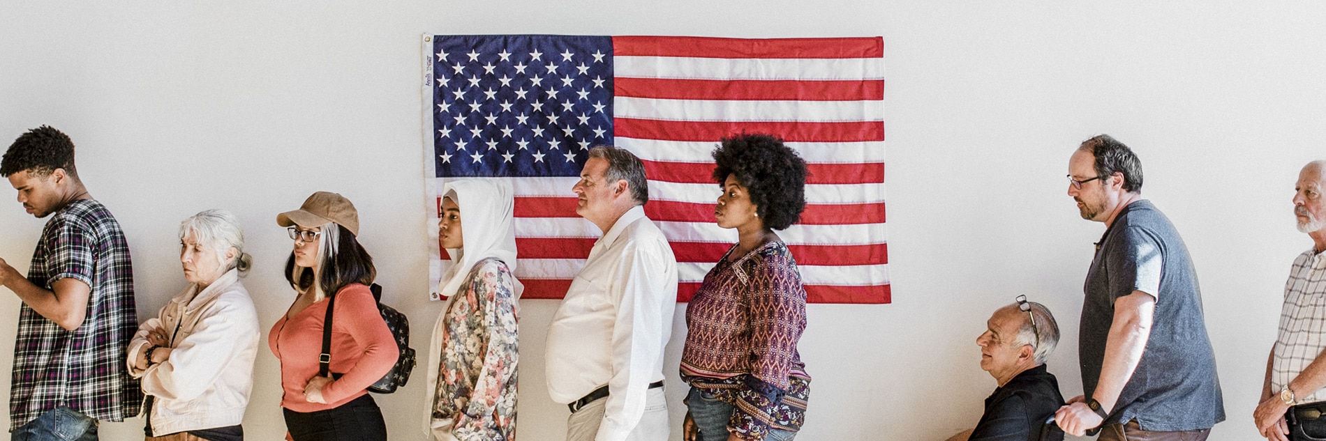 American voters waiting in line at a polling place