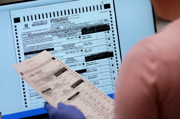 An election worker verifies a ballot on a screen inside the Maricopa County Recorder's Office, Nov. 10, 2022, in Phoenix. (AP Photo/Matt York, File)